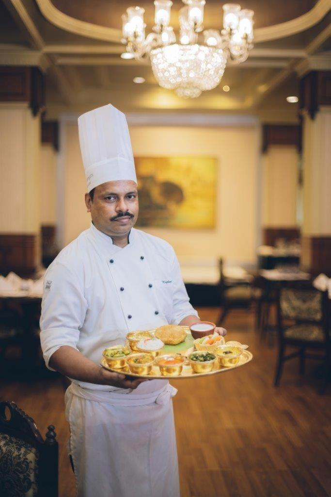 Taj Ganges Varanasi Exterior photo A chef with a selection of Indian snacks